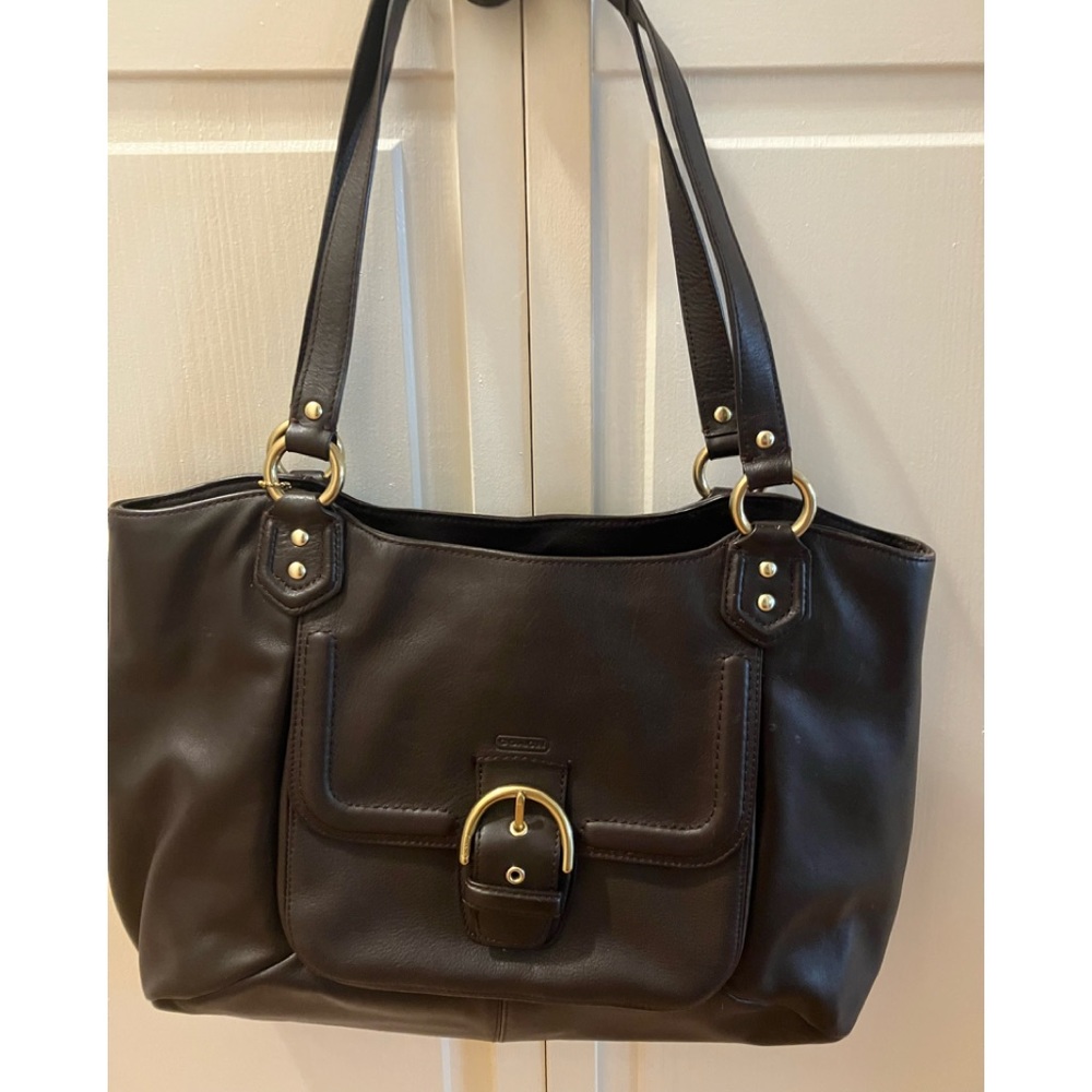 Brown leather coach bag with buckle